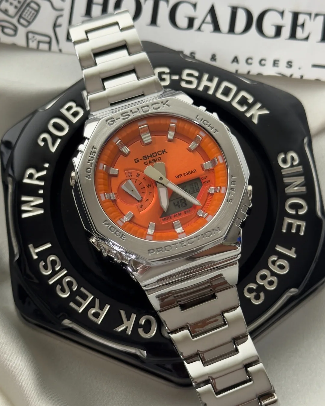 GShock-GM2110D (Analog Digital Watch) GShock-GM2110D (Analog Digital Watch) – Orange Dial / Silver Strap