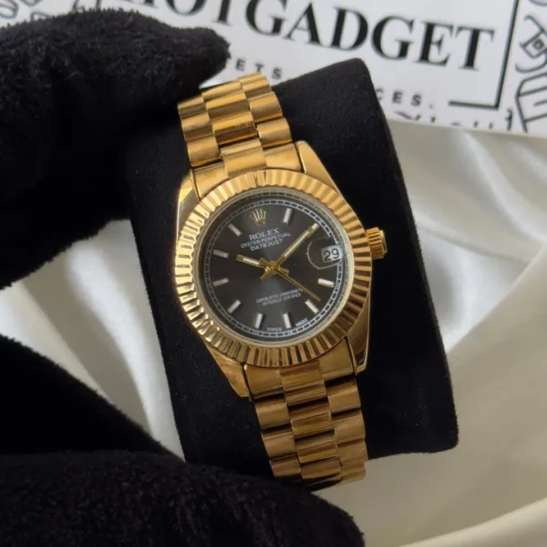 RLX Day-Date 40 – Oyster – Black Dial / Gold Strap