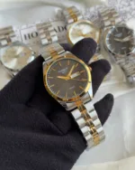 TST PR100 (Analog Watch) – Black Dial / Silver & Gold Two-Tone Strap